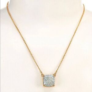 Kate Spade square pendant necklace on gold chain.